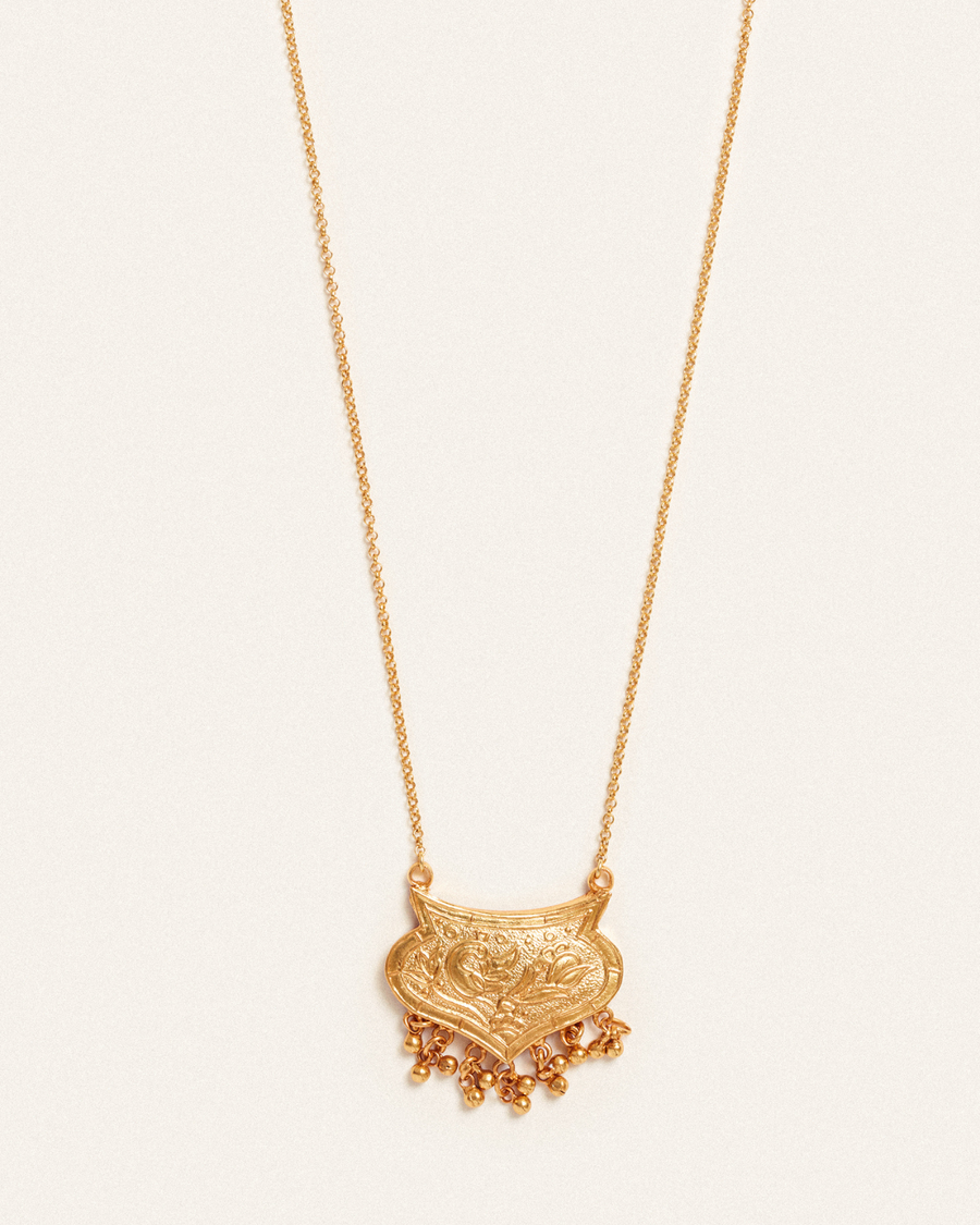 Golden peacock pendant with tassels