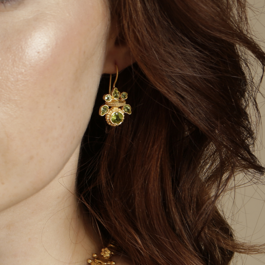Intricate peridot heritage gold earrings
