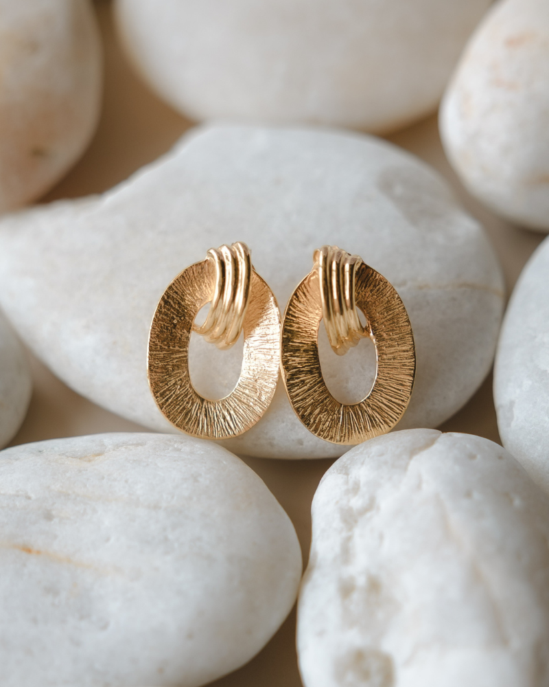 Omega earrings in gold