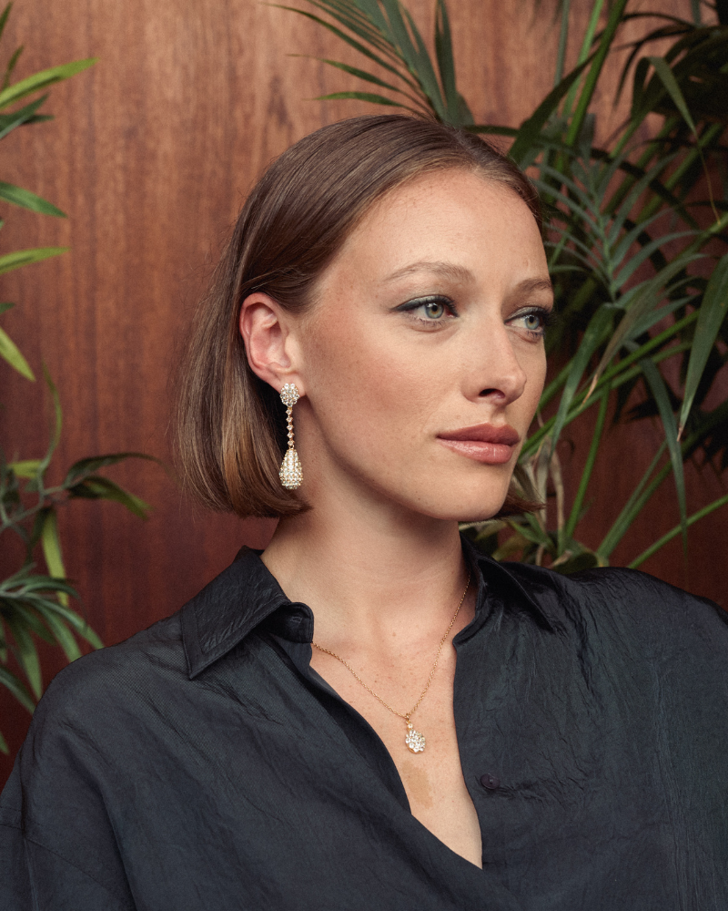 Pendulum statement earrings with blue and white topaz