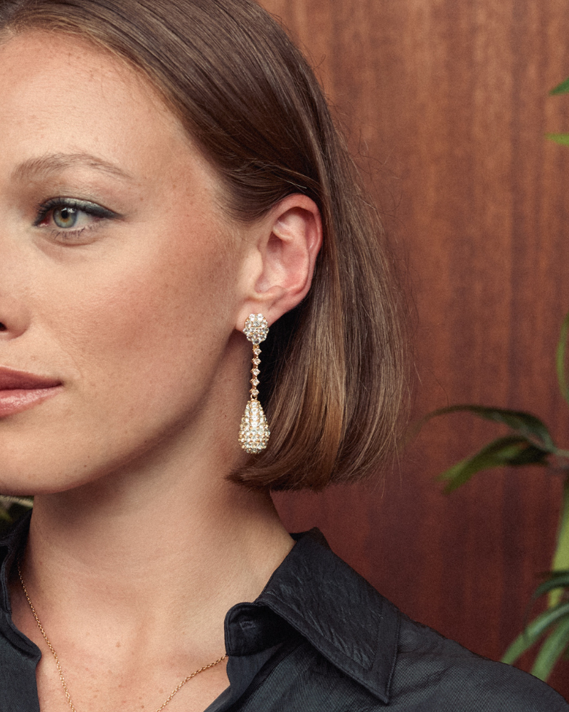 Pendulum statement earrings with blue and white topaz