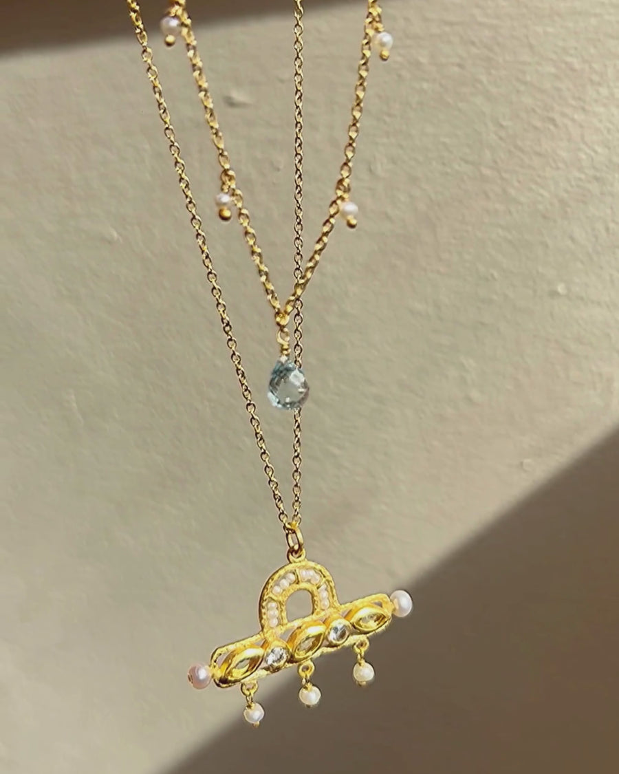 Laurel necklace with blue topaz and pearl