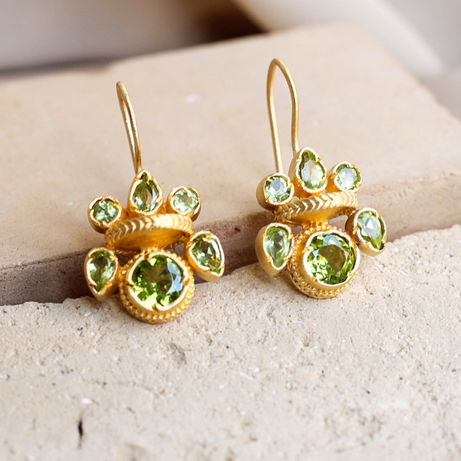 Intricate peridot heritage gold earrings