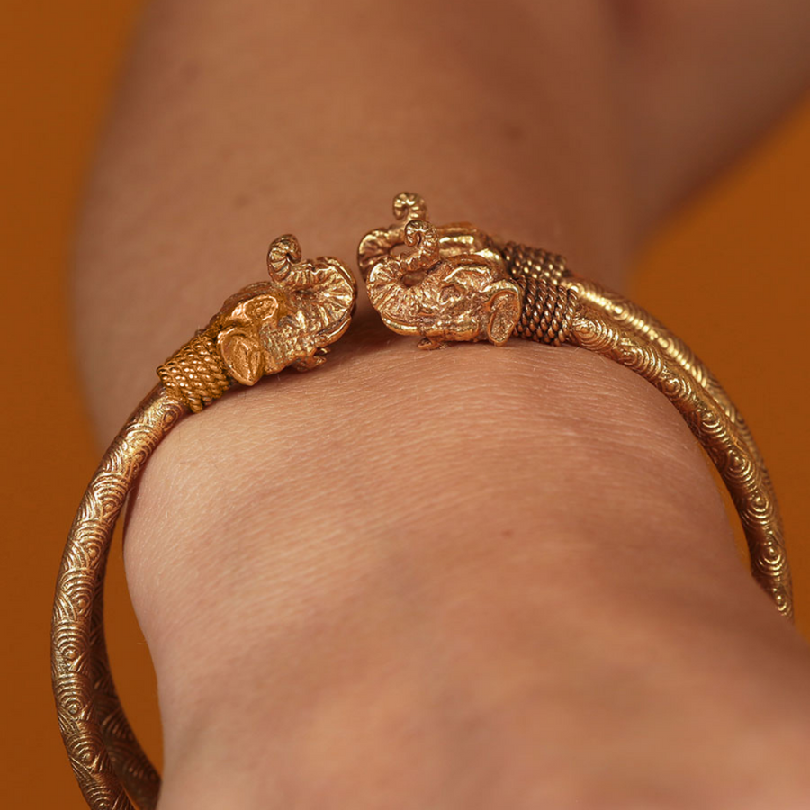 Delicate regal gold elephant bangle